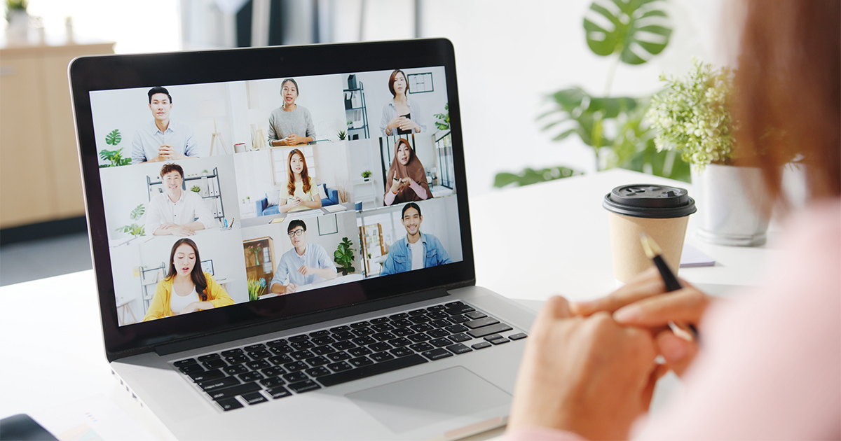 Woman in a virtual meeting on her laptop, working from home